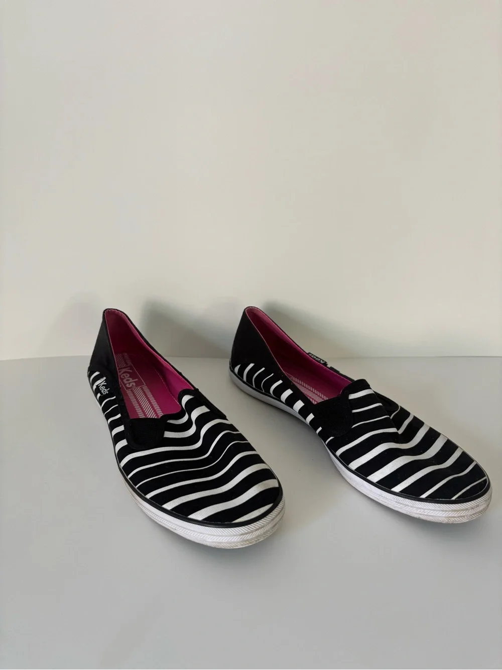 Keds Women’s Black & White Striped Slip-On Sneakers with Pink Insole